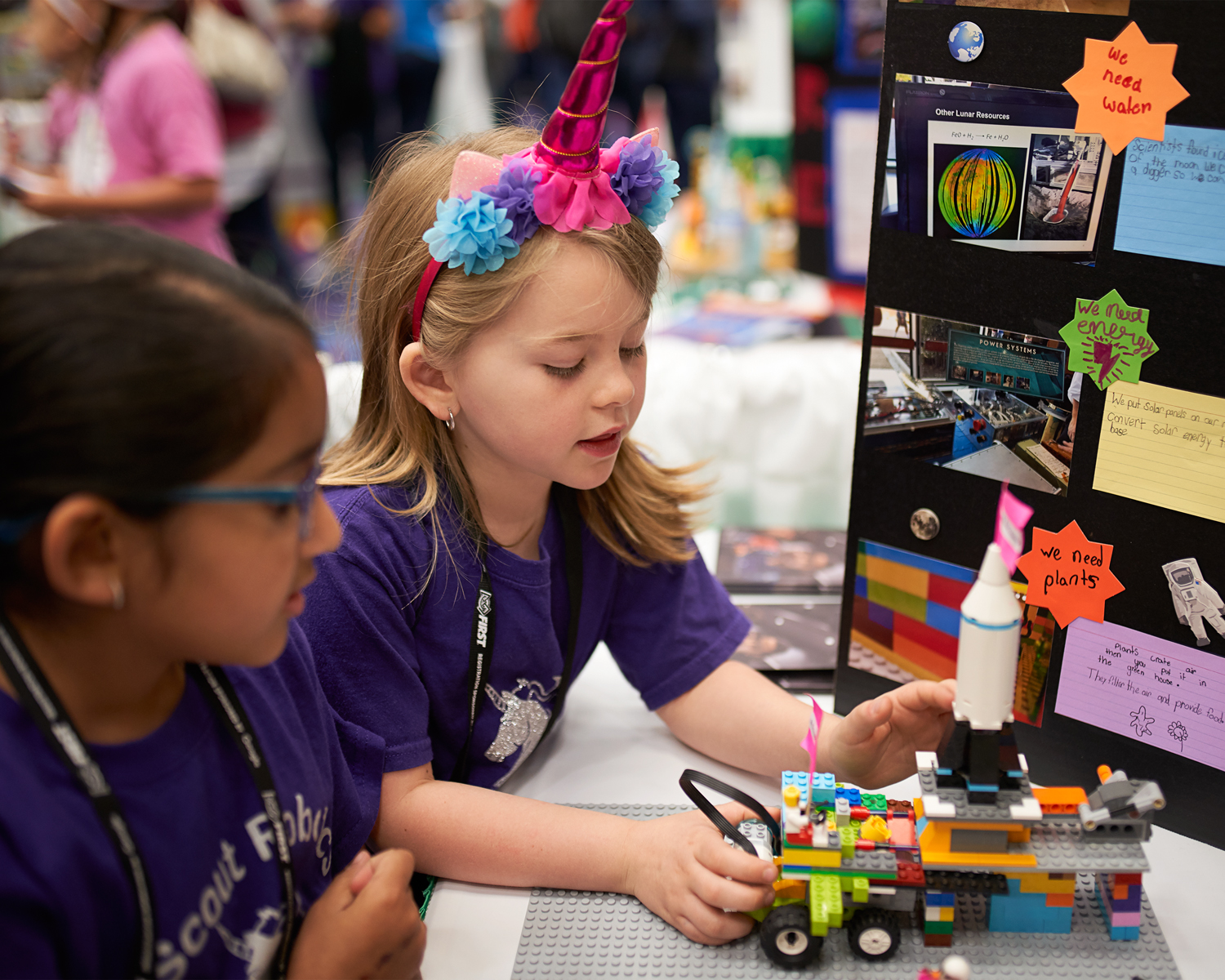 Two young girls at the First LEGO League Jr. challenge.